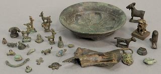 Group or miniature archaic bronze and metal figures and items and a molded bowl with gilt remnants to include goats, birds, belt buc...