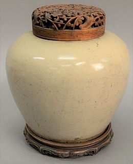 Chinese glazed ovoid jar with pierced carved hardwood cover and carved stand. vase: height 8 inches, total: height 10 inches,   ...