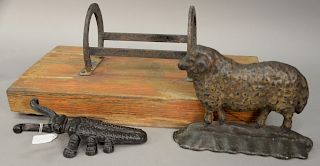 Three piece lot to include a Victorian iron door stop molded as a sheep in original paint, an iron horse shoe boot scraper, and a be...