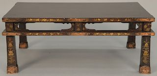 Japanese lacquered coffee table with brass mounts on square legs.  height 14 inches, top: 20 1/2" x 35"   Provenance: Estate o...