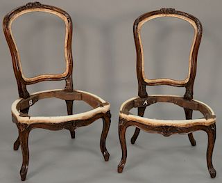 Pair of Louis XV style side chairs with floral carved crest. height 34 inches   Provenance: Estate of Peggy & David Rockefeller...