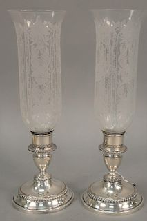 Pair of Sheffield silver plated candlesticks with etched glass shades. height 15 1/2 inches 

Provenance: Estate of Peggy & David Ro...