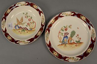 Set of thirty-eight Cauldon English plates and bowls including eighteen plates and twenty bowls, painted with birds and flowers and...