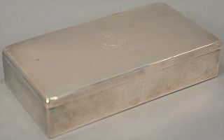 Sterling silver box with coat of arms on top (small dents). height 1 1/2 inches, top: 3 1/4" x 6 1/4" inches, 6.6 troy ounces 

Prov...