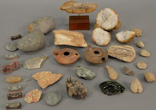 Tray lot of ancient and fossilized items to include two ancient Roman clay oil lamps, fossilized fish and horn, carved quartz (as is...