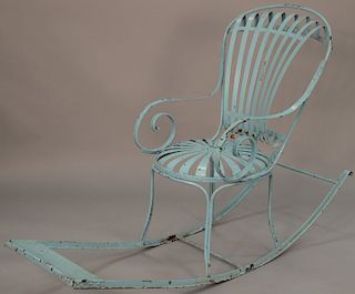 Iron rocking chair with spring form seat and back, having large rockers with footrest. length 63 inches   Provenance: Estate of...