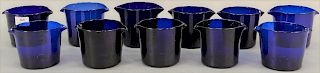 Set of eleven cobalt blue English wine glass coolers, cylindrical vessel with tooled lip on either side of the rim, ground pontil ma...