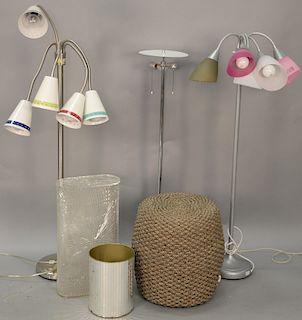 Six piece lot to include modern chrome two light floor lamp, two contemporary floor lamps, a wicker poof, and two waste baskets. chr...