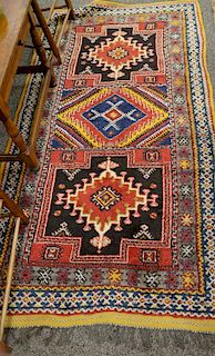 Group of four rugs to include Oriental throw rug, 3'6" x 6'7" and three small throw carpets, 2' x 2'4", 1'6" x 3', 1'6" x 3'   P...