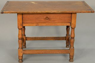 Primitive tavern table with drawer on turned legs having box stretcher (restored). height 24 inches, top: 22 1/2" x 38" 

Provenance...