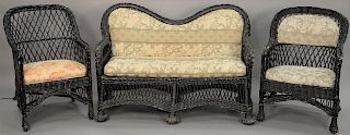 Three piece wicker set with loveseat and two armchairs. length 50 inches   Provenance: Estate of Peggy & David Rockefeller havin...
