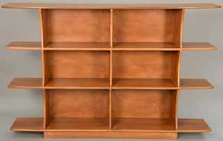 Custom modern four tier bookshelf. height 47 1/2 inches, width 72 inches, depth 11 inches   Provenance: Estate of Peggy & David...