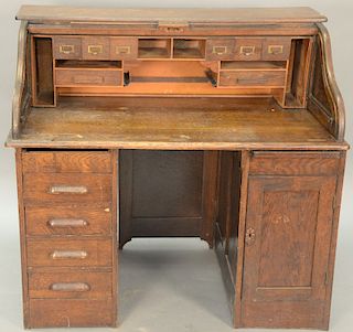 Oak S roll top desk. height 44 1/2 inches, width 48 inches   Provenance: Estate of Peggy & David Rockefeller having stamp/label.