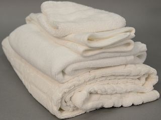 Large lot of bathwear to include bath towels, hand towels, wash towels, and approximately 20 bath mats.   Provenance: Estate of...