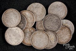 Thirteen Morgan silver dollars