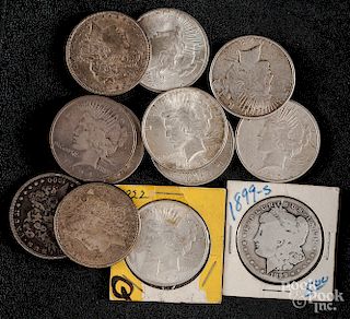 Eight Peace silver dollars