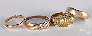 Three 10K gold rings, together with a 14K ring