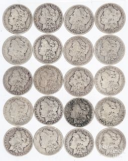 Twenty Morgan silver dollars.