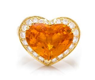 An 18 Karat Yellow Gold, Orange-Yellow Sapphire and Diamond Ring, 5.00 dwts.