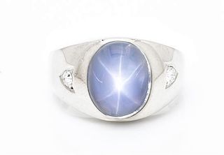 A 14 Karat White Gold, Star Sapphire and Diamond Ring, 7.50 dwts.