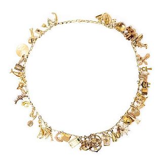 A Yellow Gold Charm Necklace with Numerous Attached Charms, 171.60 dwts.