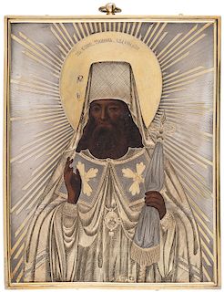 A RUSSIAN ICON OF SAINT TIKHON OF ZADONSK WITH SILVER-GILT OKLAD, ST.PETERSBURG, 1862