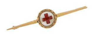 A RUSSIAN GOLD AND GUILLOCHE ENAMEL RED CROSS BROOCH, WORKMASTER FYODOR LORIE, MOSCOW, 1908-1916