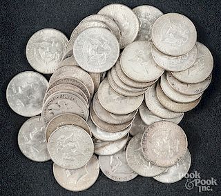 Eight pre-1964 silver half dollars