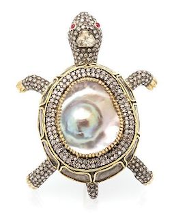 * A 10 Karat Yellow Gold, Diamond, Mabe Pearl and Ruby Tortoise Brooch, 18.00 dwts.