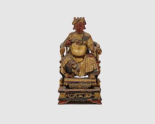 Carved, Painted, and Gilt Decorated Figure of a Deity Seated on an Elaborately Carved and Painted Throne