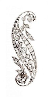 A White Gold and Diamond Swirl Brooch, 8.00 dwts.