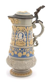 A Mettlach Pottery Pewter Mounted Stein Height 14 1/2 inches.