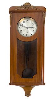 A Continental Walnut Cased Wall Clock Height 32 inches.