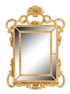 A Louis XV Giltwood Mirror Height 55 x width 38 1/2 inches.