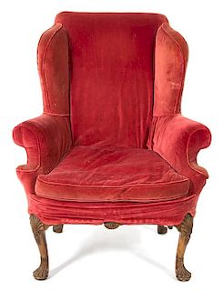 A George II Style Carved Walnut Wing Chair Height 46 inches.