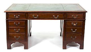 A George III Style Mahogany Double-Pedestal Desk Height 29 1/2 x width 60 x depth 36 inches.
