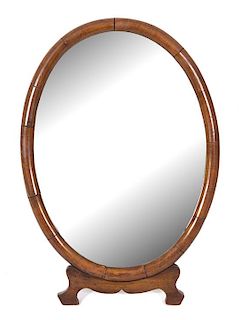 A George III Mahogany Oval Easel Back Dressing Mirror Height 20 3/4 x width 14 1/4 inches.