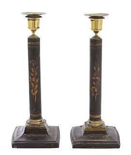 A Pair of Regency Ebonized and Gilt Decorated Candlesticks Height 12 inches.