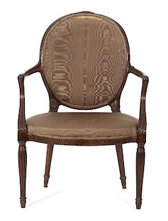 A Regency Carved Mahogany Oval Back Open Armchair Height 36 1/2 inches.