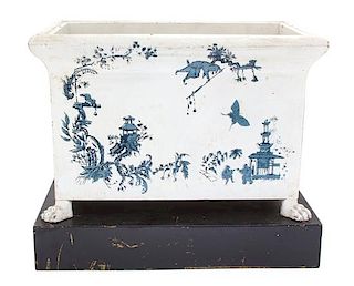 An English Painted Tole Jardiniere Height 11 x width 13 1/4 x depth 8 3/4 inches.