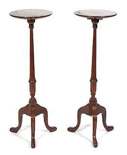 A Pair of Mahogany Tripod Candlestands Height 37 inches.
