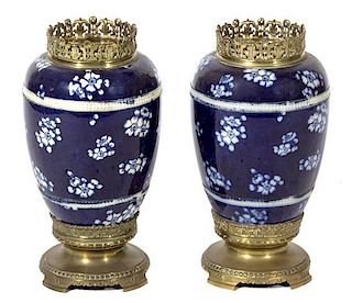 A Pair of Japanese Blue and White Hawthorne Pattern Porcelain Vases Height 16 inches.