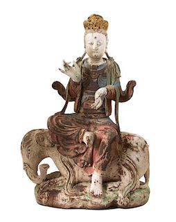 A Southeast Asian Polychromed Carved Wood Figure of Bodhisattva Astride an Elephant Height 32 1/2 inches.