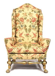 A Spanish Baroque Style Giltwood Wing Chair Height 56 inches.