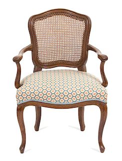 A Louis XV Style Cane-Back Fauteuil Height 35 1/2 x width 25 1/2 x depth 20 1/2 inches.