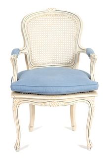 A Louis XV Style Carved and Painted Cane Back and Seat Fauteuil Height 36 inches.
