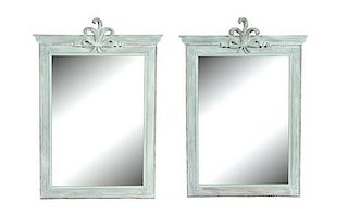 A Pair of Carved and Painted Mirrors Height 48 x width 29 1/2 inches.