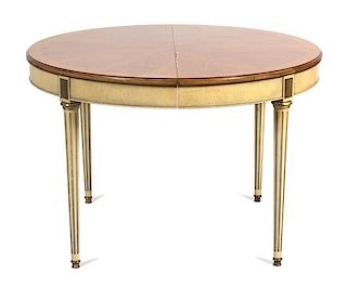 An Oval Louis XVI Style Painted Dining Table Height 29 1/2 x diameter 44 inches. Each leaf 20 inches.