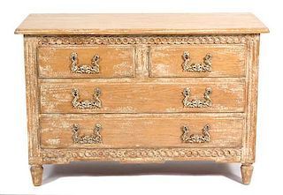 A Provincial Style Carved and Distressed Finish Chest of Drawers height 34 x width 50 1/2 x depth 21 inches.