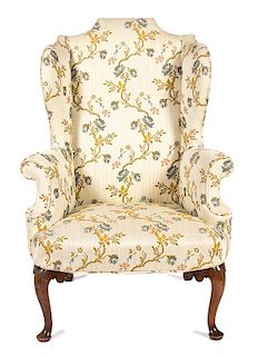 A Queen Anne Style Mahogany Wing Chair Height 47 inches.